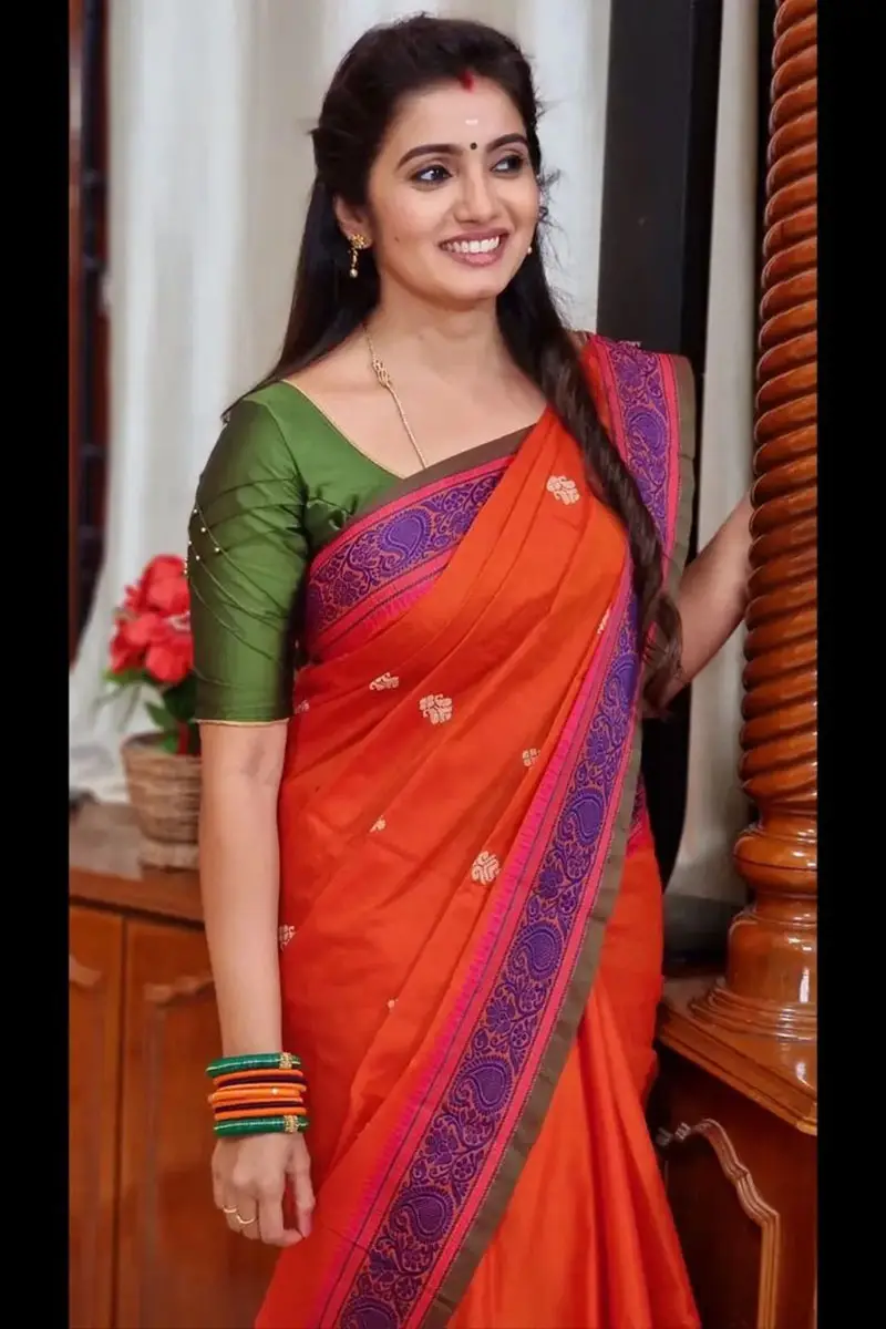 Tamil TV Actress Srithika Photos In Orange Saree Green Blouse